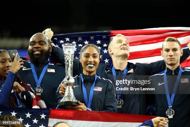 Captain Queen Harrison lifts the trophy as Team USA celebrate victory during day two of the Athletics World Cup London at the London Stadium on July...