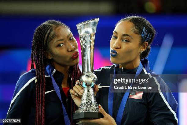 Captain Queen Harrison and Courtney Okolo lift the trophy as Team USA celebrate victory during day two of the Athletics World Cup London at the...