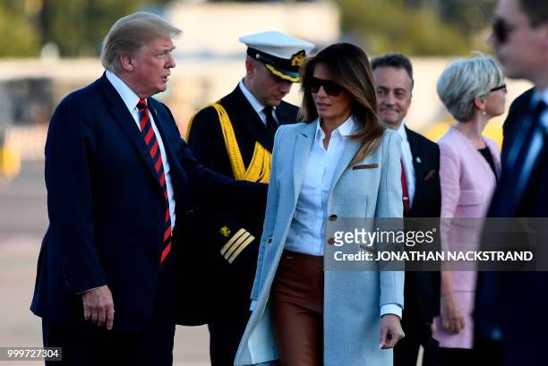 President Donald Trump and First Lady Melania Trump walk towards the Presidential cars after disembarking from Air Force One upon arrival at...
