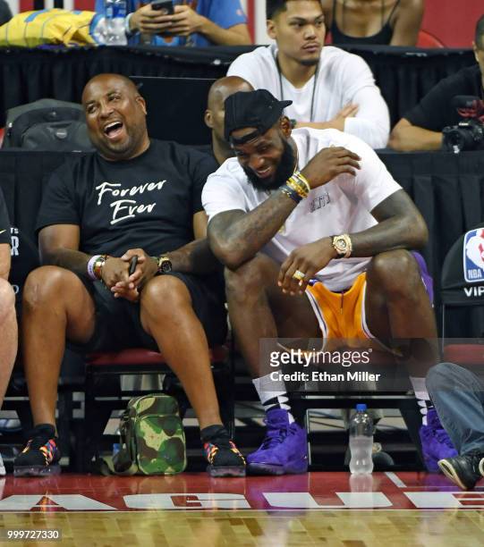 Randy Mims and LeBron James of the Los Angeles Lakers laugh as they attend a quarterfinal game of the 2018 NBA Summer League between the Lakers and...