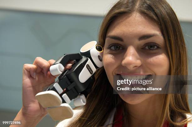 Simona speaks on the phone using the smartphone robot 'RoboHon' at the stand of Sharp at the international electronics fair IFA in Berlin, Germany, 4...