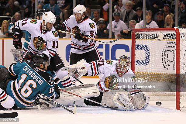 Devin Setoguchi of the San Jose Sharks shoots the puck as goaltender Antti Niemi of the Chicago Blackhawks makes a save in the first period of Game...