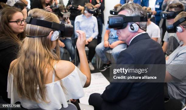 German Minister of the Interior Thomas de Maiziere uses virtual reality glasses in Hohenschoenhausen in Berlin, Germany, 04 September 2017. De...