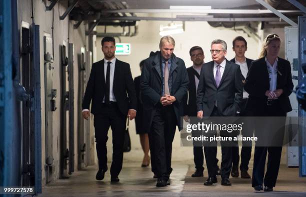 Memorial site director Hubertus Knabe shows German Minister of the Interior Thomas de Maiziere around in the memorial site Hohenschoenhausen of the...