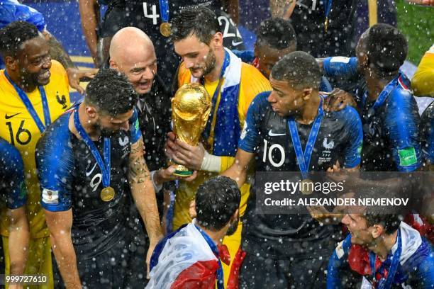 President Gianni Infantino gives the trophy to France's goalkeeper Hugo Lloris during the trophy ceremony after winning the Russia 2018 World Cup...