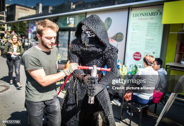 Figure of the Star Wars villain Kylo Ren is being carried into a department store where it will be part of the Star Wars decoration in...