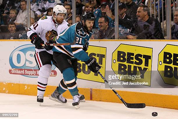 Scott Nichol of the San Jose Sharks moves the puck against Brian Campbell of the Chicago Blackhawks in the first period of Game Two of the Western...