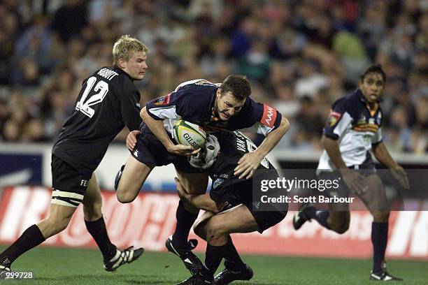 Stirling Mortlock is tackled during the ACT Brumbies v Stormers Super 12 rugby match played at Bruce Stadium, Canberra Australia. DIGITAL IMAGE....