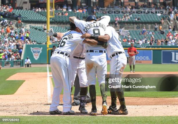 Jeimer Candelario, James McCann, Nicholas Castellanos and Dixon Machado of the Detroit Tigers celebrate a grand slam home run hit by McCann while...