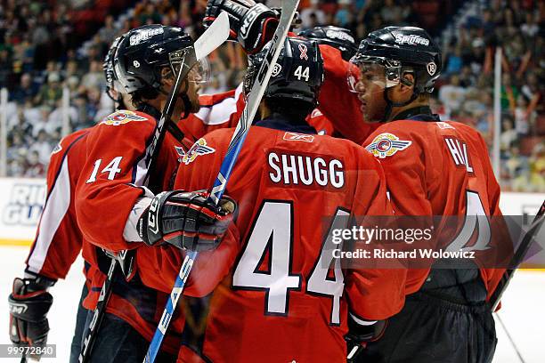 Members of the Windsor Spitfires celebrate the second period goal; from Justin Shugg during the 2010 Mastercard Memorial Cup Tournament game against...