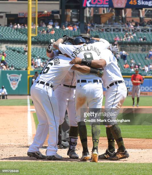 Jeimer Candelario, James McCann, Nicholas Castellanos and Dixon Machado of the Detroit Tigers celebrate a grand slam home run hit by McCann while...