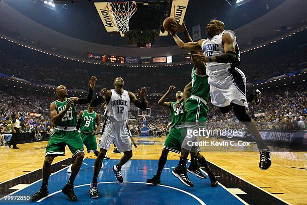 Vince Carter of the Orlando Magic drives for a shot attempt against Kendrick Perkins of the Boston Celtics in Game Two of the Eastern Conference...