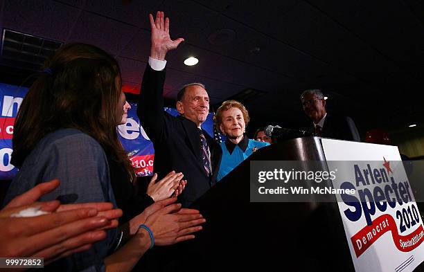 Sen. Arlen Specter waves goodbye after conceding defeat at a primary night gathering of supporters and staff with his wife Joan Specter and family...