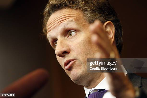 Timothy Geithner, U.S. Treasury secretary, speaks to reporters after a tour of the Port of Tacoma Marine Terminal in Tacoma, Washington, U.S., on...