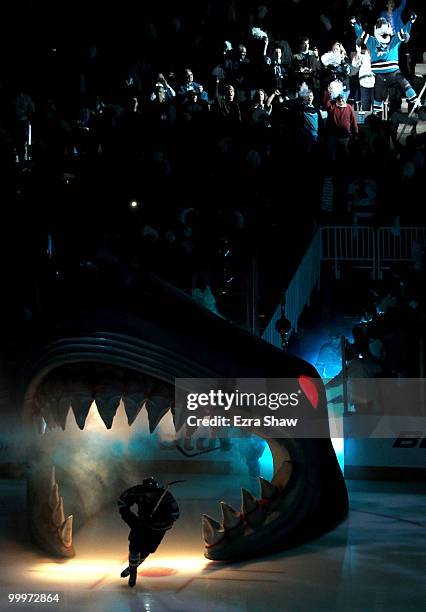 Member of the San Jose Sharks skates out onto the ice during introductions as Sharkie cheers from the stands before the Sharks take on the Chicago...