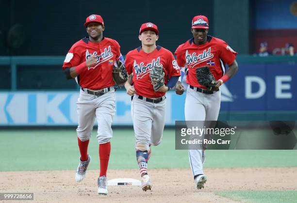 Luis Basabe of the Chicago White Sox and the World Team, Leody Taveras of the Texas Rangers and the World Team and Jesus Sanchez of the Tampa Bay...