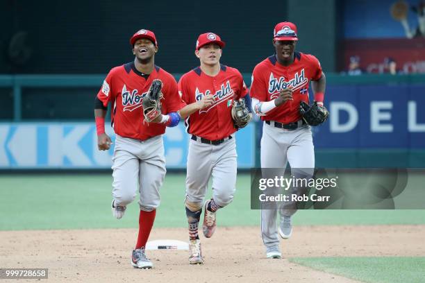 Luis Basabe of the Chicago White Sox and the World Team, Leody Taveras of the Texas Rangers and the World Team and Jesus Sanchez of the Tampa Bay...