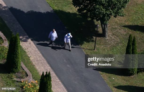 Members of the Fetullah Terrorist Organization are seen in the compound where Fetulah Gulen resides as one of them covers his face with a newspaper...