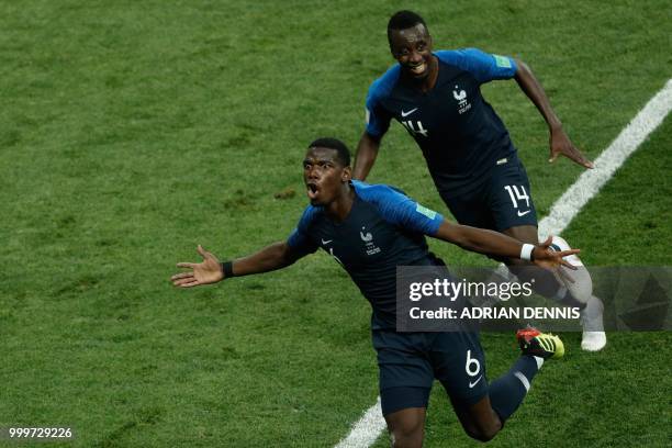 France's midfielder Paul Pogba celebrates with France's midfielder Blaise Matuidi after scoring a goal during the Russia 2018 World Cup final...