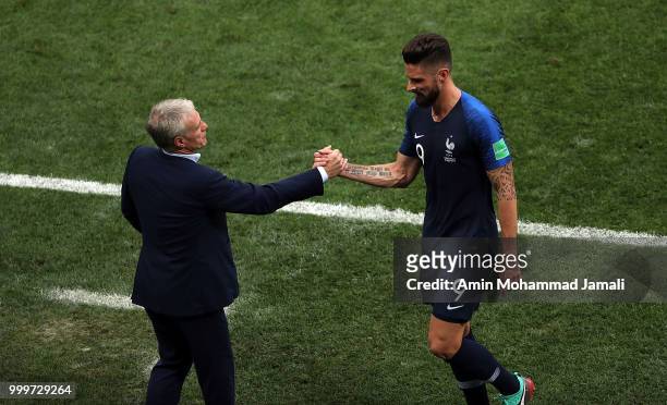 Olivier Giroud and Didier Deschamps of France looks on during the 2018 FIFA World Cup Russia Final between France and Croatia at Luzhniki Stadium on...