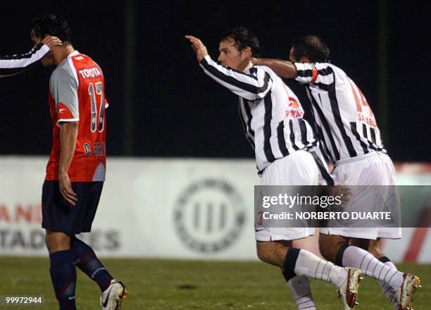 Paraguayan Libertad's players celebrate after scoring a goal against Mexico's Chivas during their Libertadores Cup football match on May 18 at...