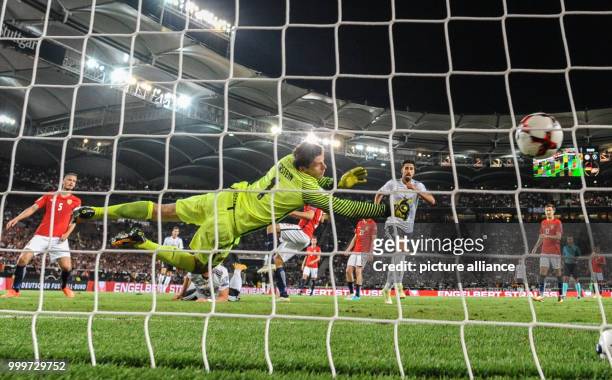 Germany's Mario Gomez scores 6-0 while Norway's goalkeeper Rune Jarstein fails to stop him during the soccer World Cup qualification group stage...