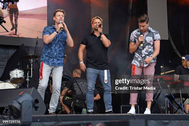 Dirk Ostermann, Florian Flesch and Timo Schulz of Die Zipfelbuben perform at the Radio B2 SchlagerHammer Open-Air-Festival at Hoppegarten on July 15,...