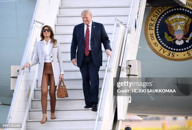 President Donald Trump and First Lady Melania Trump disembark from Air Force One upon arrival at Helsinki-Vantaa Airport in Helsinki, on July 15,...