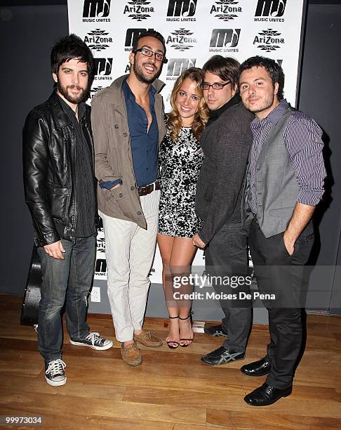 Michelle Edgar and Saen Fitzgerald, Julio Tavarez, Cliff Sarcona and Dan Nigro of As Tall As Lions perform during the first anniversary presentation...