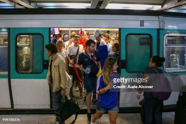 Fans in the metro going to watch the FIFA World Cup final match between France and Croatia at Fan Zone at Champ de Mars on July 15, 2018 in Paris,...