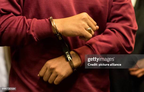 The defendant Hussein K. Is brought into the court room, awaiting his trial in Freiburg, Germany, 5 September 2017. He is accused of murdering a...