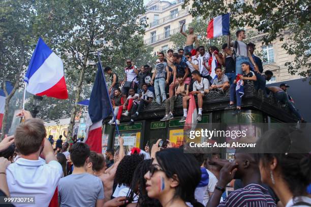 French fans celebrate the victory after the FIFA World cup final match between France and Croatia on July 15, 2018 in Paris, France.