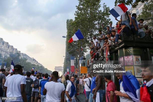 French fans celebrate the victory after the FIFA World cup final match between France and Croatia on July 15, 2018 in Paris, France.