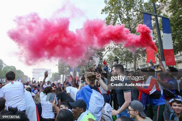 French fans celebrate the victory after the FIFA World cup final match between France and Croatia on July 15, 2018 in Paris, France.