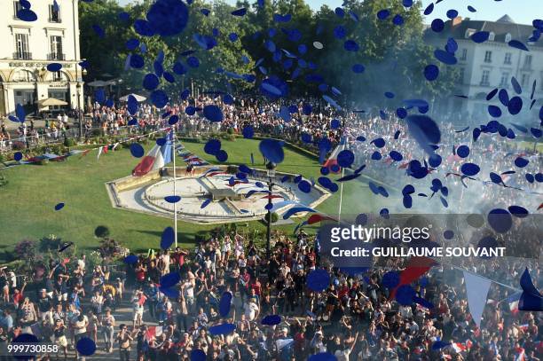 France supporters celebrate in the fan zone in Tours on July 15 after France won the Russia 2018 World Cup final football match between France and...