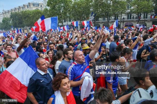 French fans celebrate the victory after the FIFA World cup final match between France and Croatia on July 15, 2018 in Paris, France.