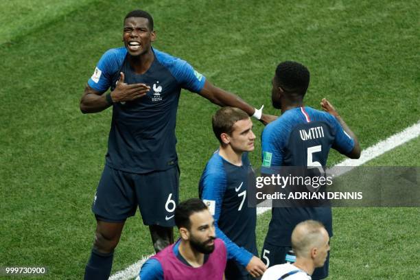 France's midfielder Paul Pogba celebrates with teammates after scoring a goal during the Russia 2018 World Cup final football match between France...