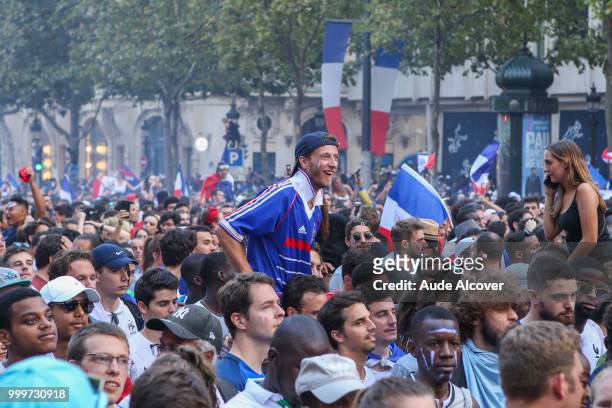 French fans celebrate the victory after the FIFA World cup final match between France and Croatia on July 15, 2018 in Paris, France.