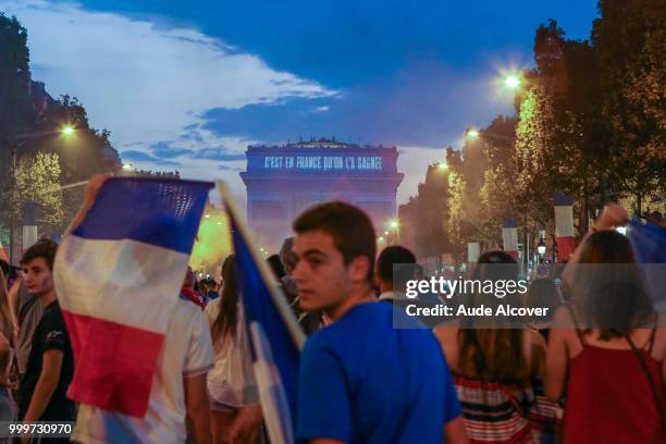 French fans celebrate the victory after the FIFA World cup final match between France and Croatia on July 15, 2018 in Paris, France.