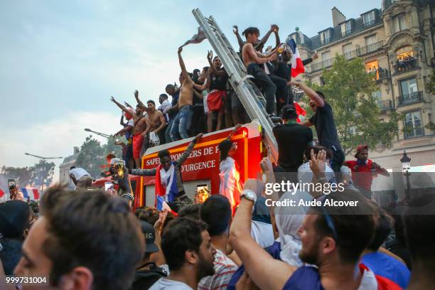 French fans celebrate the victory after the FIFA World cup final match between France and Croatia on July 15, 2018 in Paris, France.