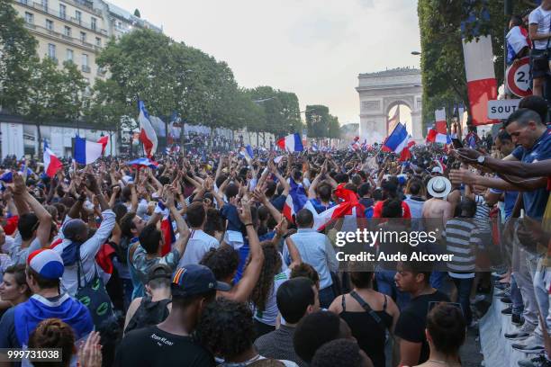 French fans celebrate the victory after the FIFA World cup final match between France and Croatia on July 15, 2018 in Paris, France.