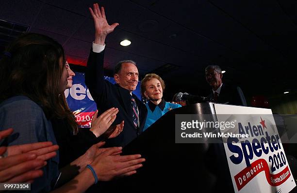 Sen. Arlen Specter waves goodbye after conceding defeat at a primary night gathering of supporters and staff with his wife Joan Specter and family...
