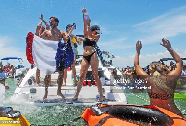 French fans celebrate winning the World Cup at the Ballyhoo Boat Bash at the Haulover Sandbar on Sunday, July 15, 2018. Ballyhoo Media set up a...