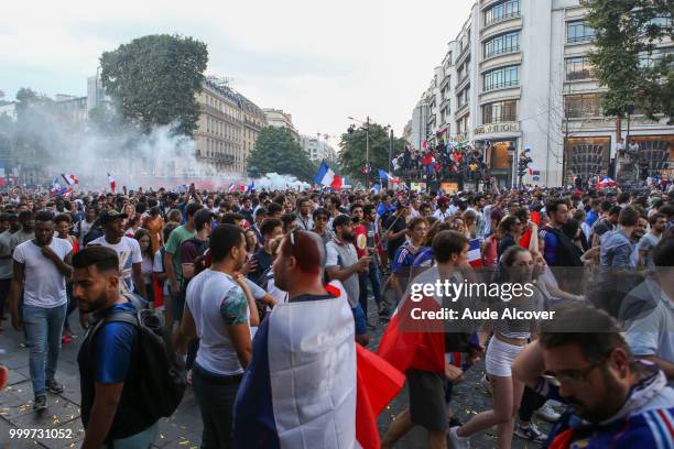 French fans celebrate the victory after the FIFA World cup final match between France and Croatia on July 15, 2018 in Paris, France.