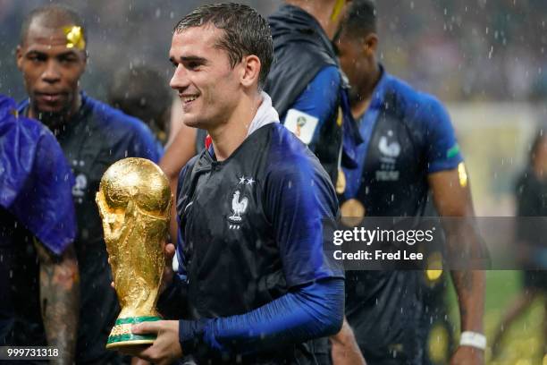 Antoine Griezmann of France celebrates with the trophy after the 2018 FIFA World Cup Russia Final between France and Croatia at Luzhniki Stadium on...