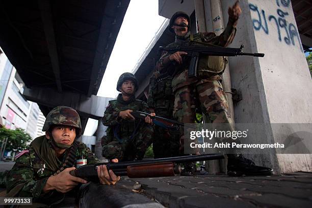 Thai Security forces take position during a clash with protesters on May 19, 2010 in Bangkok, Thailand. Protesters have clashed with military forces...