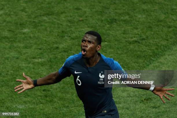 France's midfielder Paul Pogba celebrates after scoring a goal during the Russia 2018 World Cup final football match between France and Croatia at...