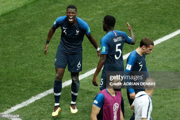 France's midfielder Paul Pogba celebrates with teammates after scoring a goal during the Russia 2018 World Cup final football match between France...