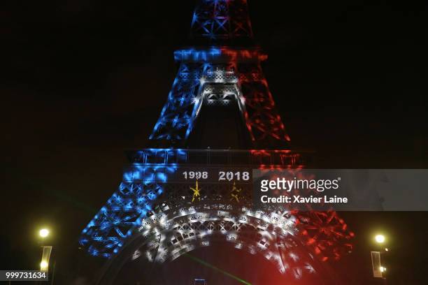 The Effeil Tower trees the two star of the French victory in the world cup. Fans Celebrate France Winning The World Cup 2018 Final Against Croatia at...