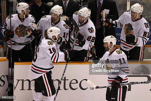 Andrew Ladd of the Chicago Blackhawks celebrates his first period goal with his teammates while taking on the San Jose Sharks in Game Two of the...